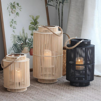 Adara Traditional Metal Floor Lantern: Featuring intricate metalwork and a distressed finish, this floor lantern exudes old-world charm and elegance, perfect for adding a touch of rustic beauty to any space.